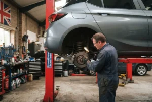 Professional suspension repair and inspection at a UK automotive garage